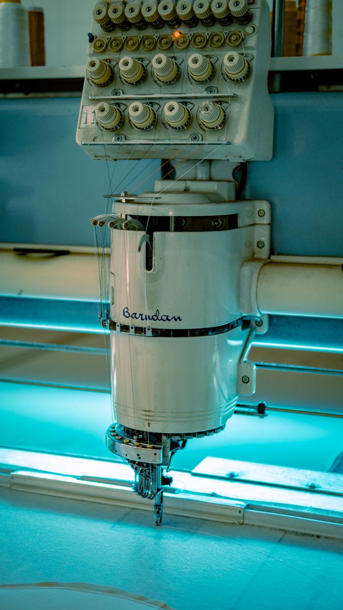 Close-up of an industrial sewing machine used in textile manufacturing in Ankara, Türkiye.